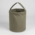 Green fabric bucket with handle on a white background