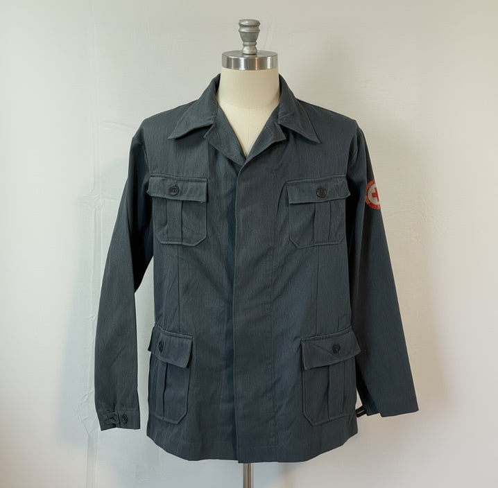 Dark gray jacket on a mannequin against a white background