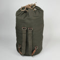 Green backpack with straps on a white background